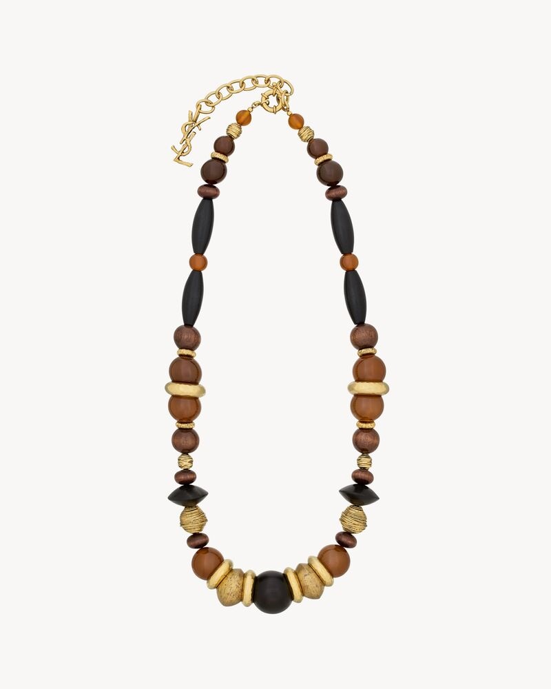 oversized necklace in glass, wood, resin, and metal