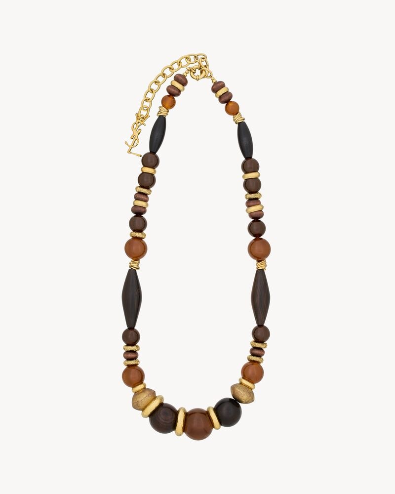 oversized necklace in glass, wood, resin, and metal