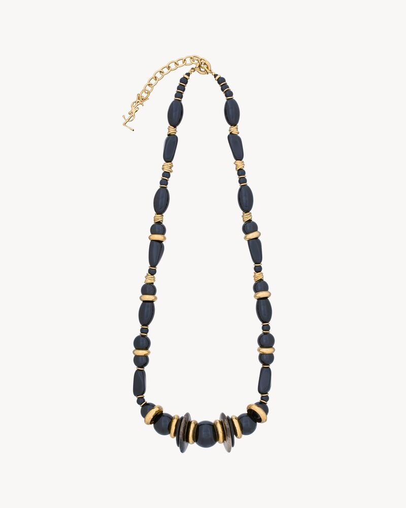 oversized necklace in gemstones, resin, and metal